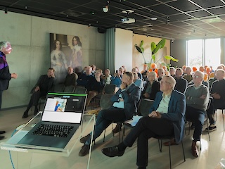 Deelnemers aan het symposium in de zaal.