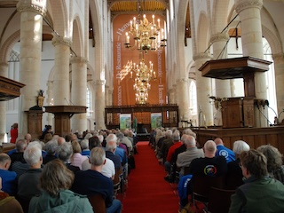 Deelnemers vrijwilligersbijeenkomst in de Grote Kerk in Naarden. (Hans Koreman)